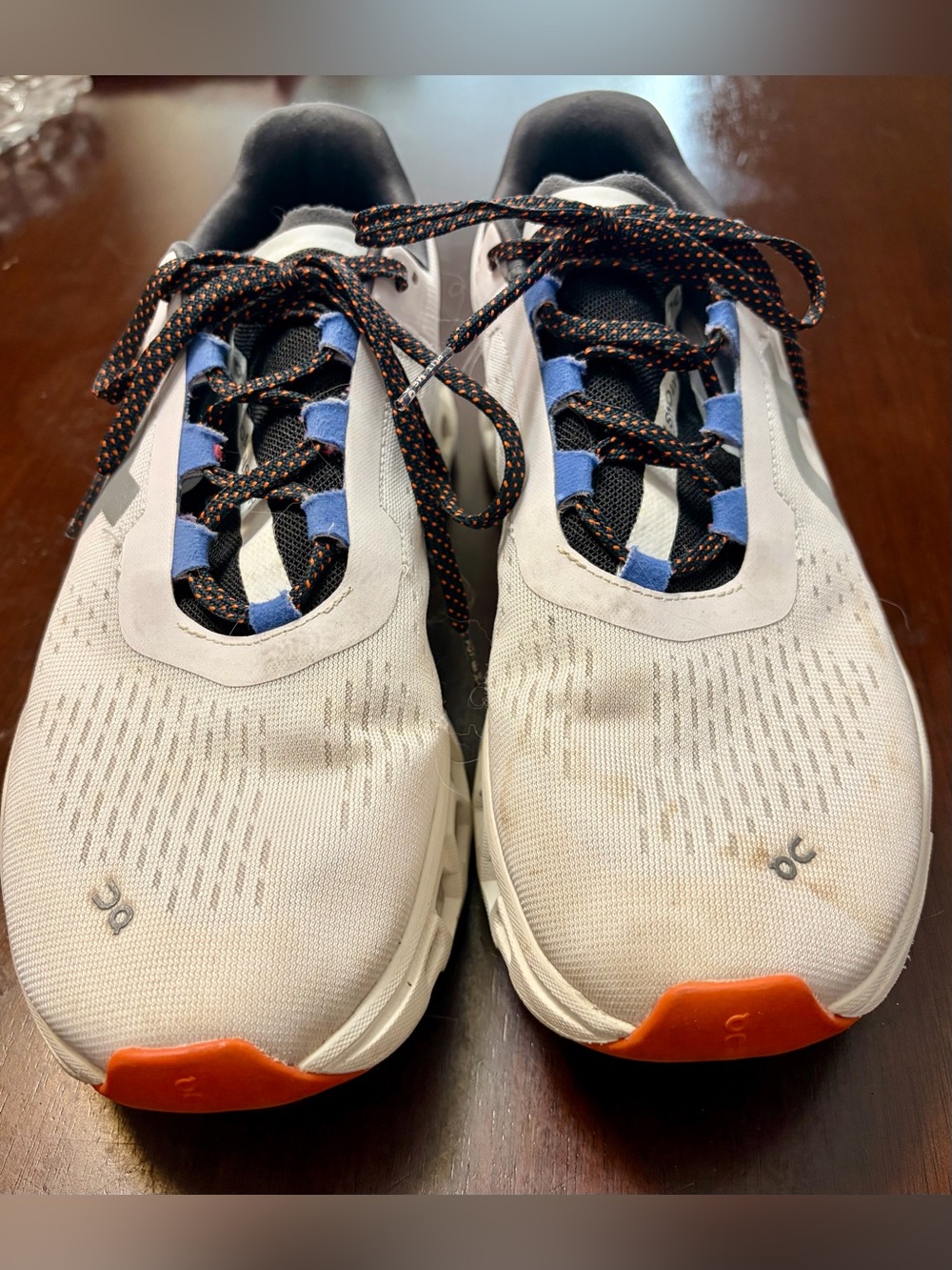 On Running Women’s Athletic Shoes - White with Orange and Blue Accents